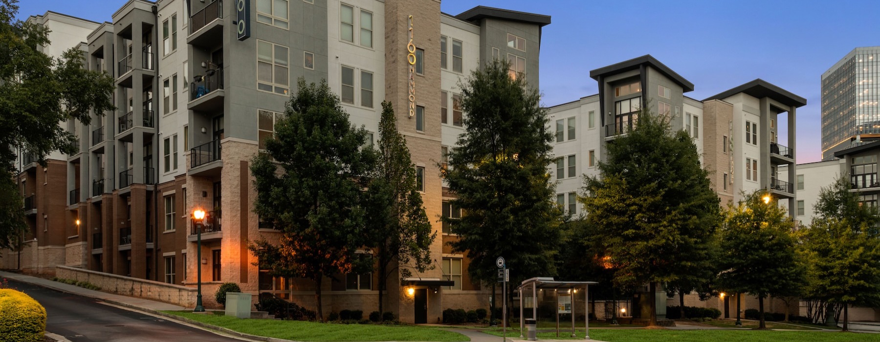 a large building with trees in front of it