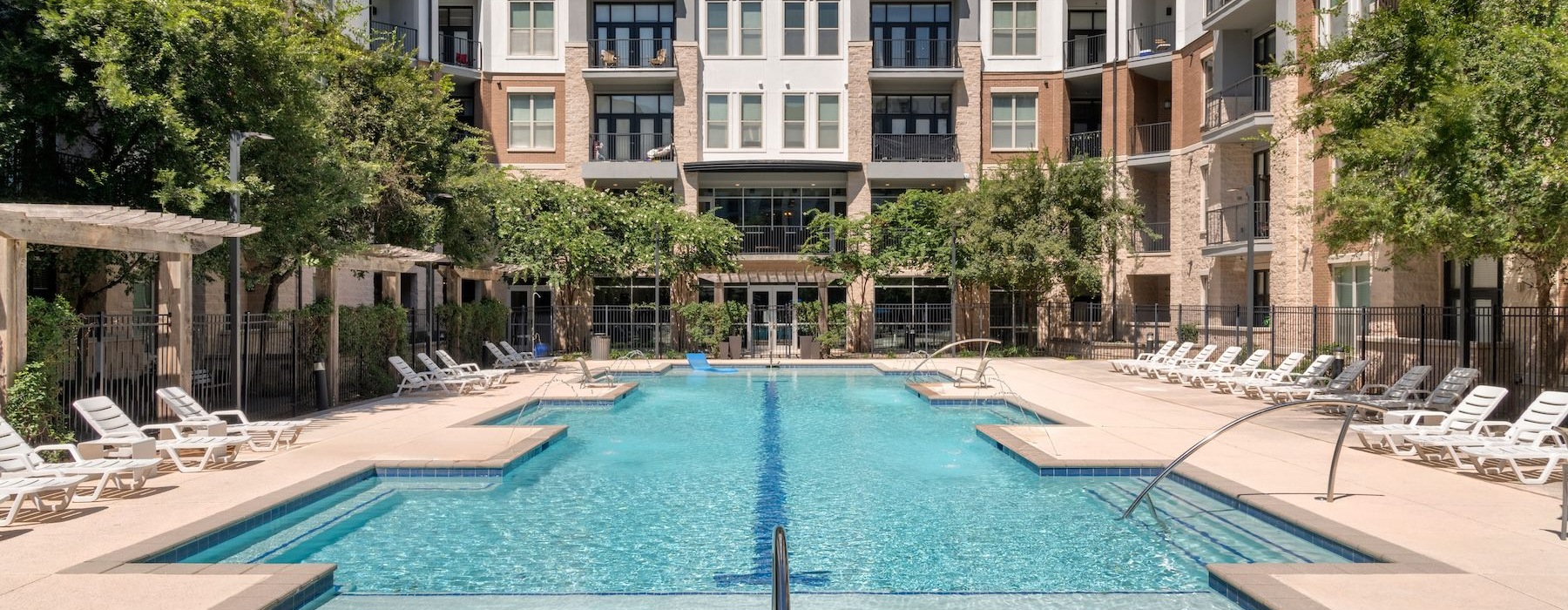 a swimming pool in front of a building