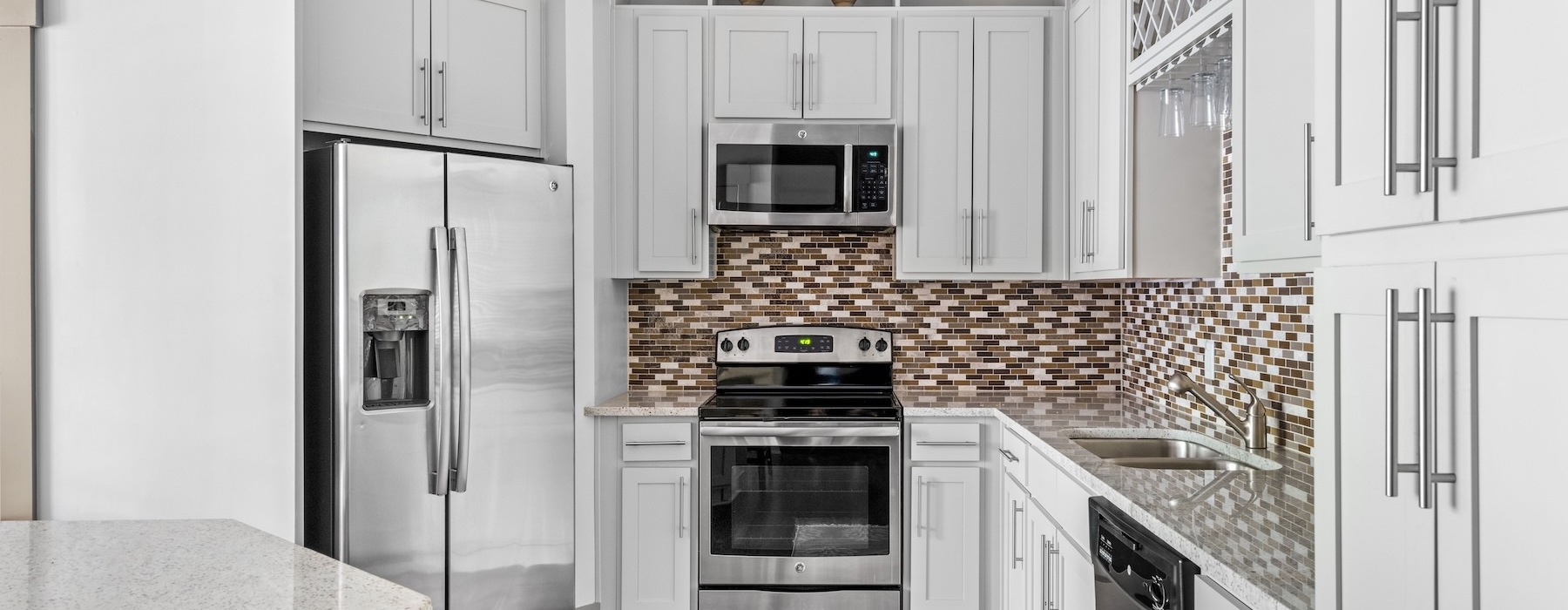 a kitchen with white cabinets