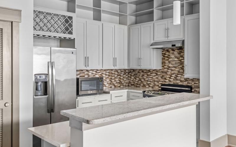 a kitchen with white cabinets