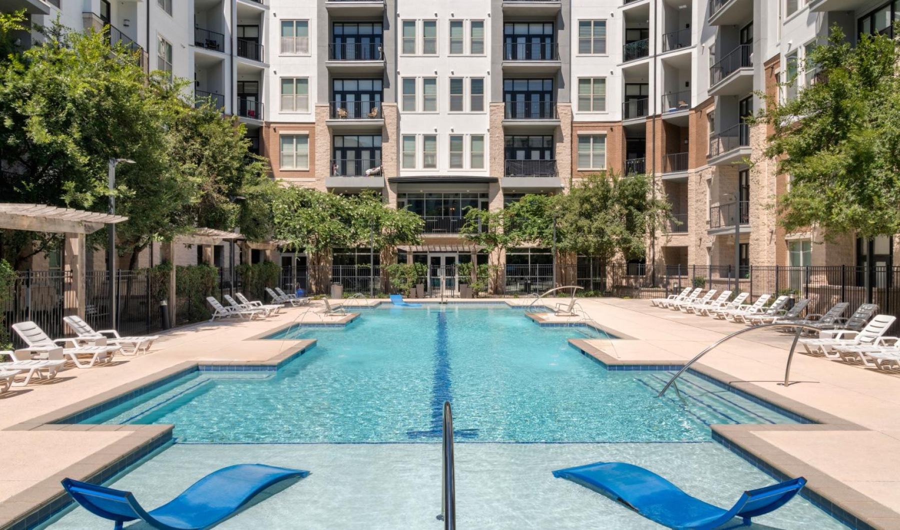 a swimming pool in front of a building